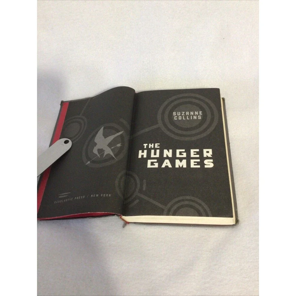 Scholastic The Hunger Games Suzanne Collins First Edition Hardcover‎ Grey Good
